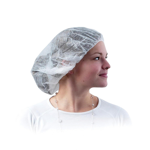 White disposable mob cap worn by a woman, 100 pack