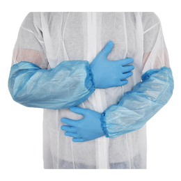 Blue disposable polythene oversleeves worn over a coverall